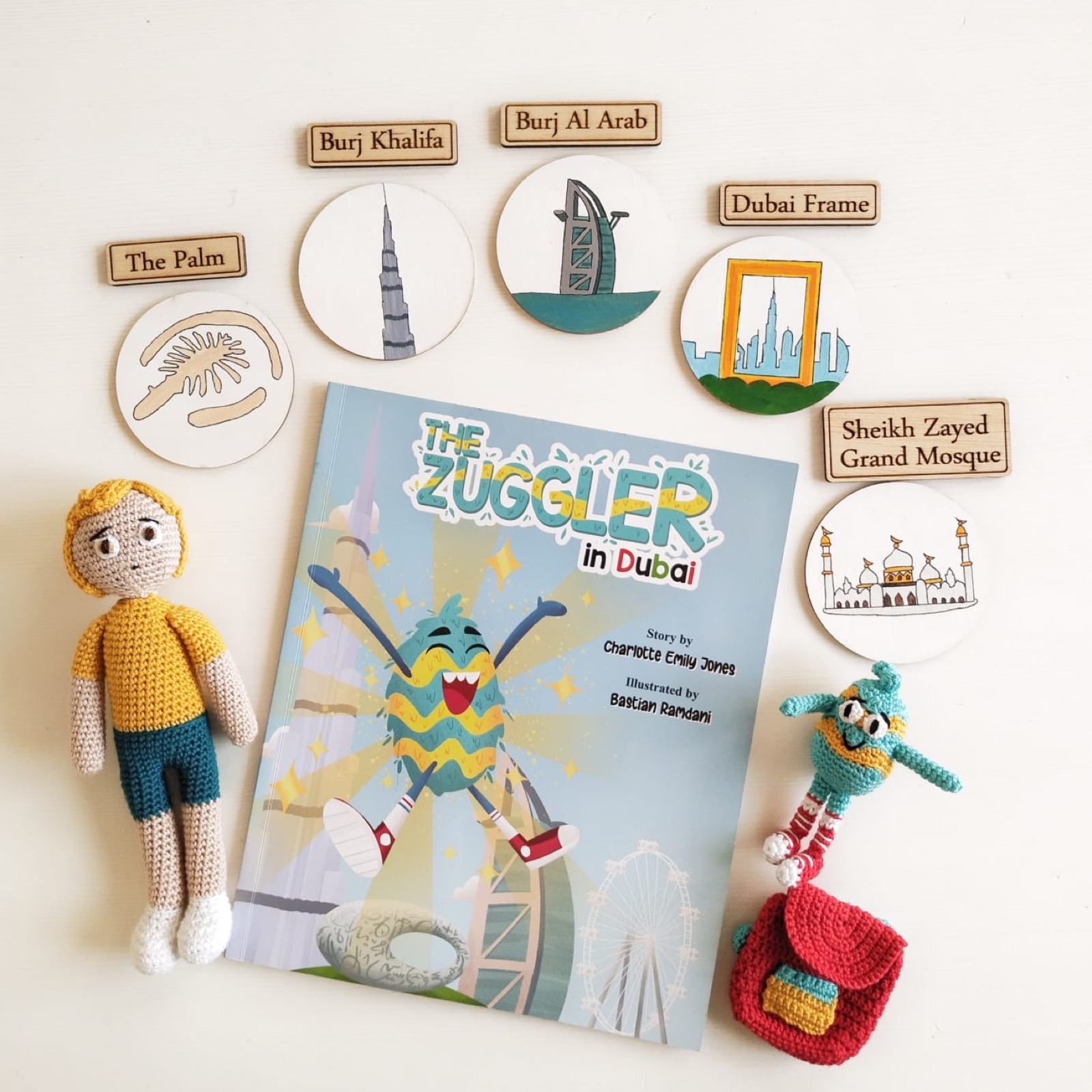 The Zuggler in Dubai Story Sack with hand-knitted characters and painted landmark tags